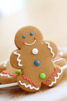 Smiling gingerbread man with brightly colored buttons