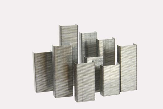 Staples office equipment isolated on a white background arranged in a city scape