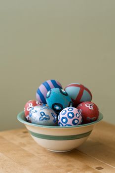 Hand painted easter eggs in a bowl