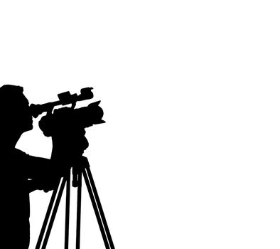 Silhouette of a Cameraman Filming