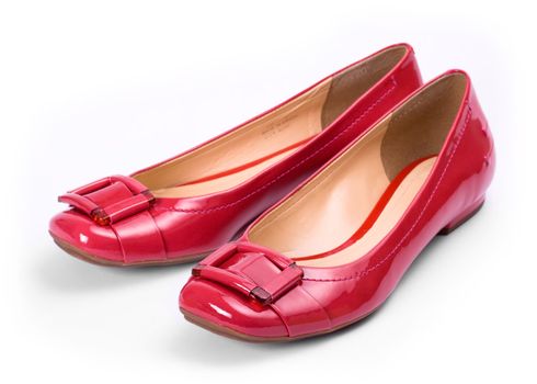 Shiny red shoes against a white background