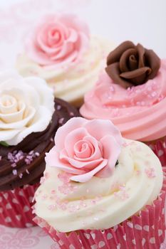 Cupcakes for a wedding, decorated with sugar roses