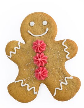 Smiling gingerbread man with sugar flower buttons