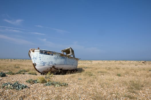 An old fishing boat on the beach at Dungeness