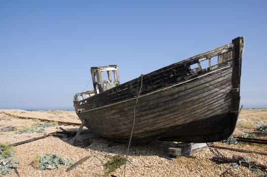 An old fishing boat on the beach at Dungeness