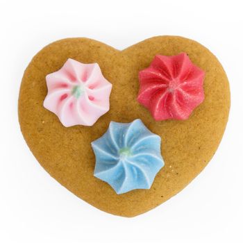 Gingerbread heart decorated with three sugar flowers