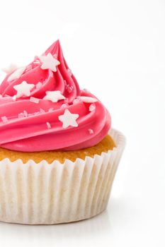 Pink cupcake isolated against a white background