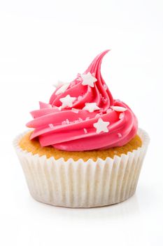 Pink cupcake isolated against a white background