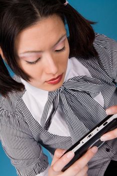 Young concentrated girl playing a game.