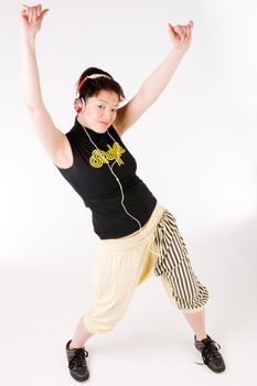 Young girl enjoying the music and dance on it