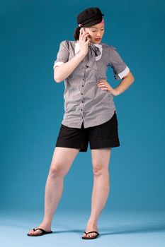 Young asian girl is calling and standing. Full body photogrphed