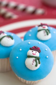 Festive cupcakes decorated with tiny sugar snowmen