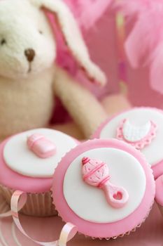 Cupcakes decorated with a baby girl theme