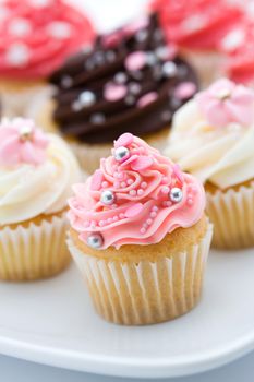 Assortment of pink and white cupcakes