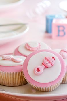 Cupcakes decorated with a baby girl theme