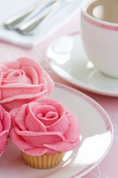 Cupcakes decorated with pink buttercream roses