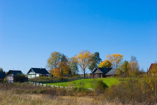 Autumn rural scene with country houses