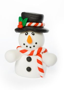 Cheerful snowman wearing top hat and striped scarf