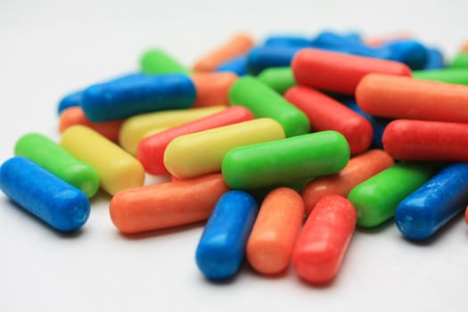 A pile of colored candy in basic colors