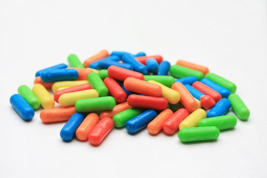 A pile of colored candy in basic colors