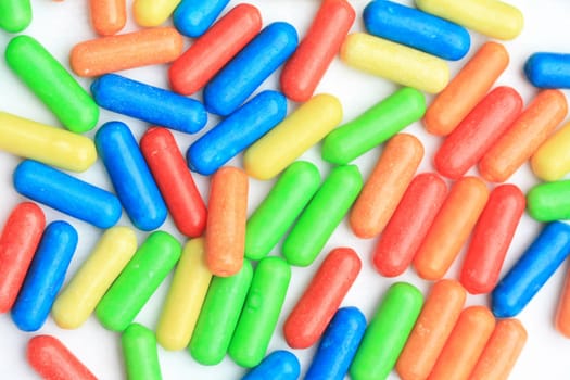 A group of colored candy in basic colors