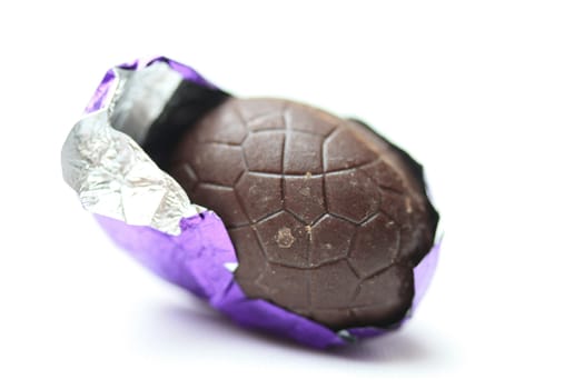 A chocolate easter egg in purple foil