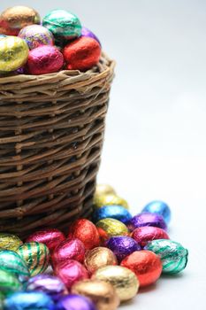 A wicker basket with chocolate easter eggs