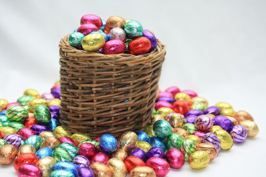 A wicker basket with chocolate easter eggs