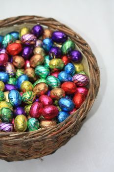 A wicker basket with chocolate easter eggs