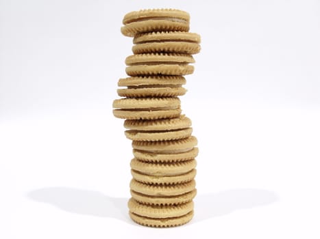 Large tower of vanilla cookies on a white background