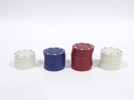 Four stacks of poker chips on a white background