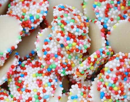 white chocolate drops covered with sprinkles