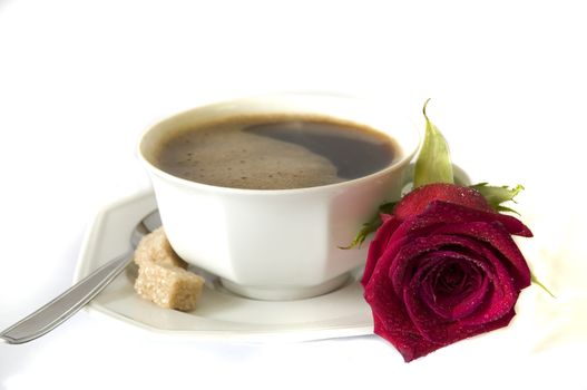 perfect morning surprise, whith love; fresh cup of coffee and fresh red rose, isolated on white