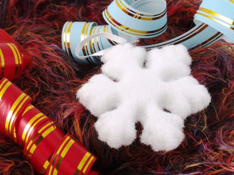 Christmas snowflake and color ribbons on a fluffy background