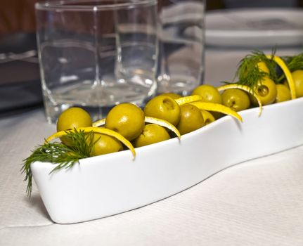 a collection of green olives like part of the Mediterranean diet