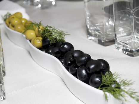 a collection of green and black olives like part of the Mediterranean diet