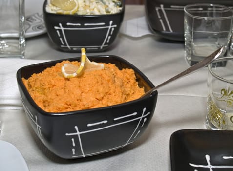 Beautifully served carrot salad in black dish