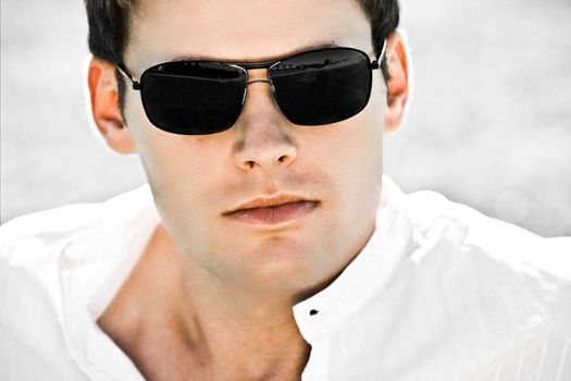 Closeup Of An Attractive Man With Black Sunglasses
