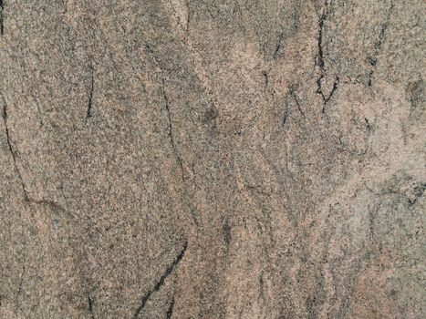 Red-grey granite shot close-up which can be use as background.