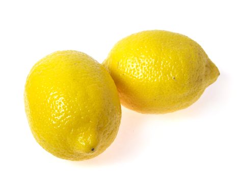 Photo of two lemons on white background