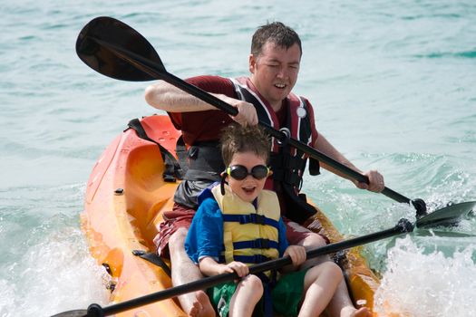 Father and son enjoying a kayak trip