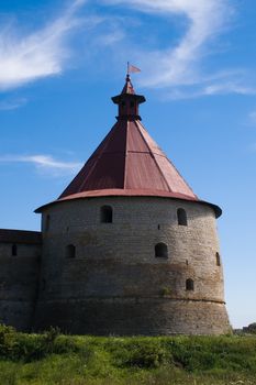 Ancient castle tower at sunny summer day