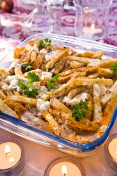 Sliced potato and chicken baked in breading