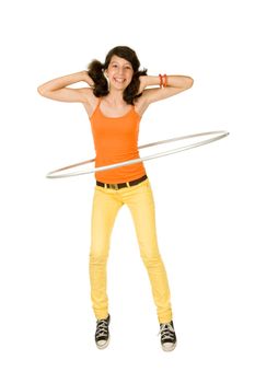 Joyful teenager girl with hula hoop on white background