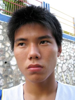 a portraits of a angry Asian boy