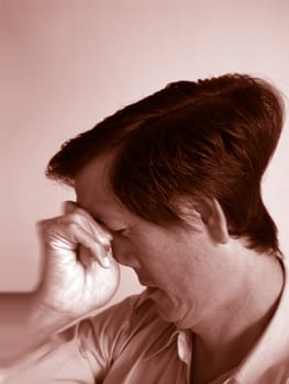 a Asian man looks tired and headache, monotone