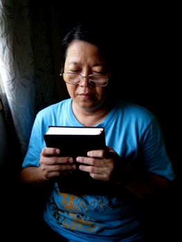 a Asian woman is praying