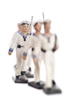 Marching Toy Soldiers Isolated on White Background