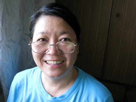 a happy smiling Asian woman
