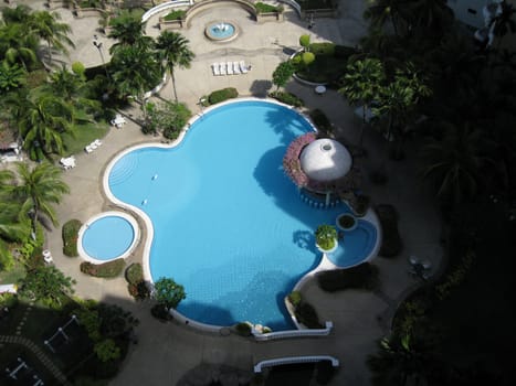 a top view of a swimming pool in a resort